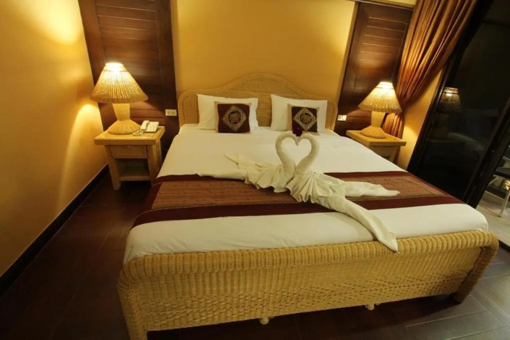 Bed in PhoomThai Garden Hotel