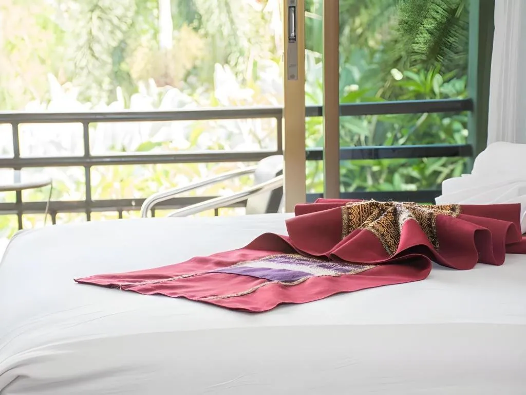 Bed in PhoomThai Garden Hotel