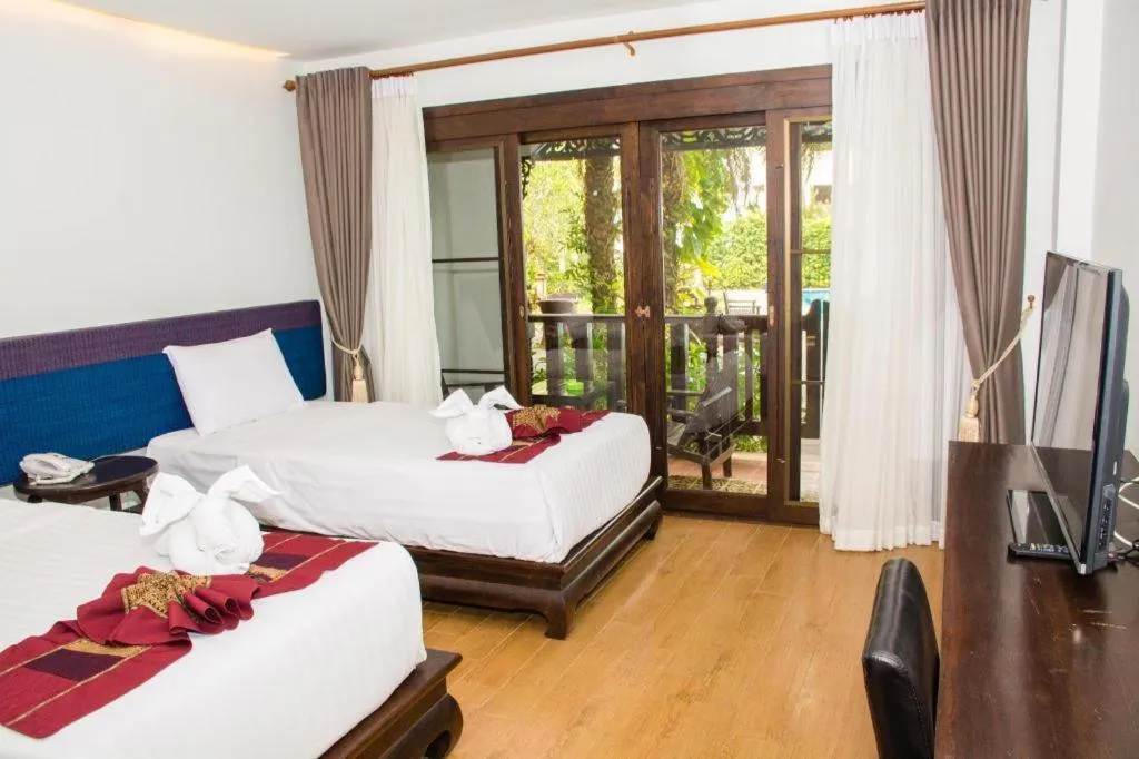 Bed in PhoomThai Garden Hotel