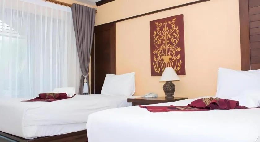 Bed in PhoomThai Garden Hotel