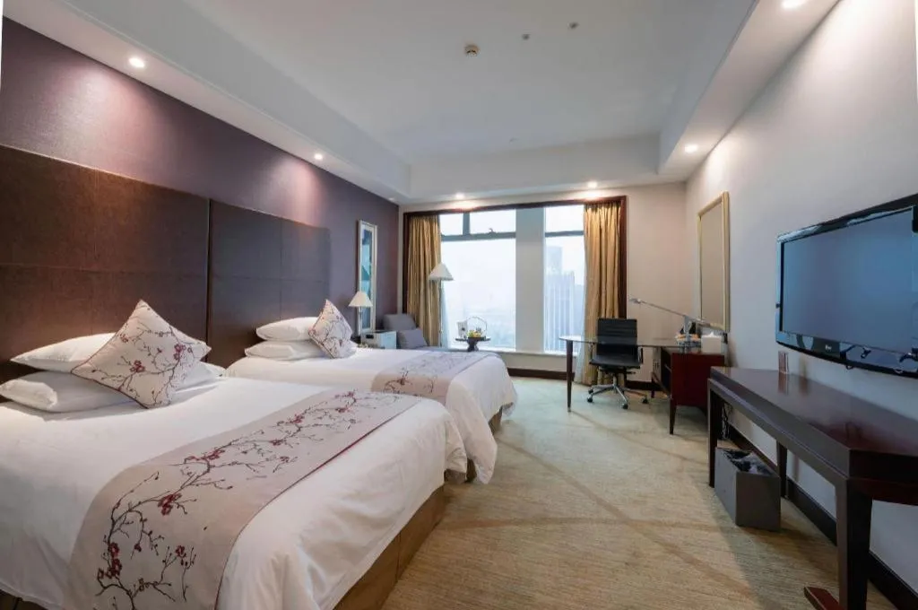 Bed in New Century Grand Hotel Zhuji Yaojiang