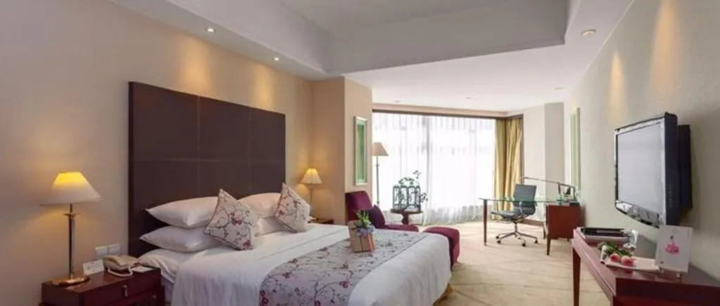 Bed in New Century Grand Hotel Zhuji Yaojiang