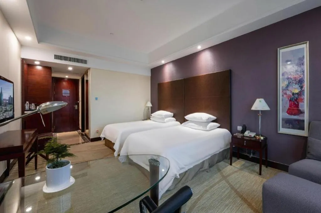 Bed in New Century Grand Hotel Zhuji Yaojiang