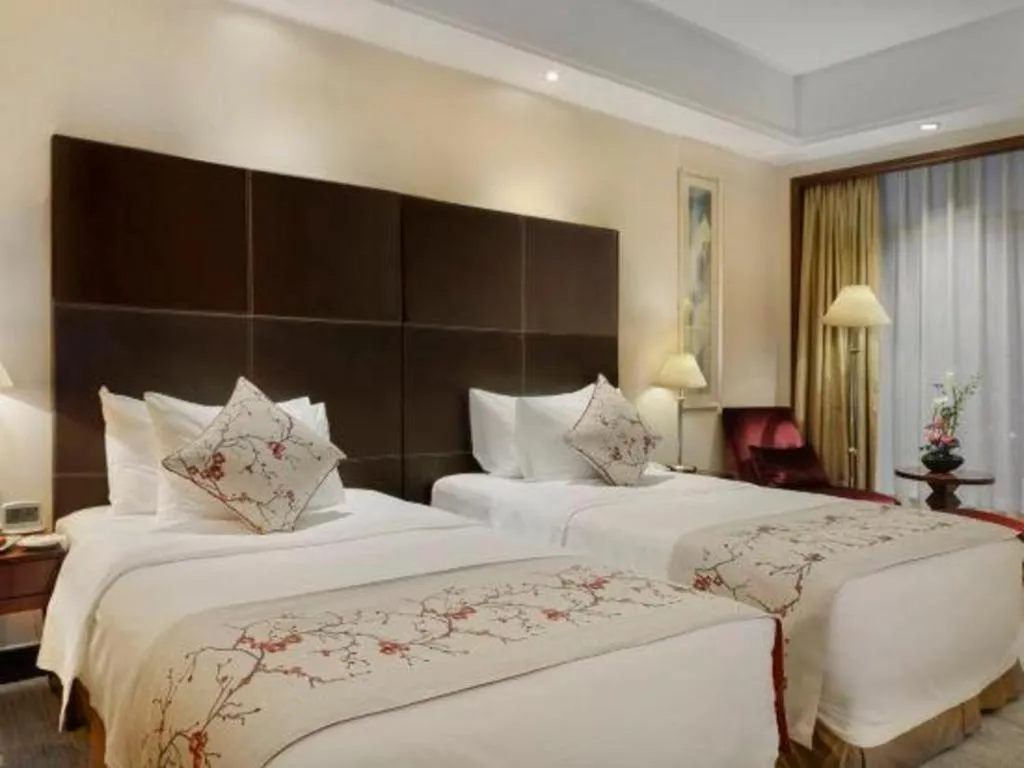 Bed in New Century Grand Hotel Zhuji Yaojiang