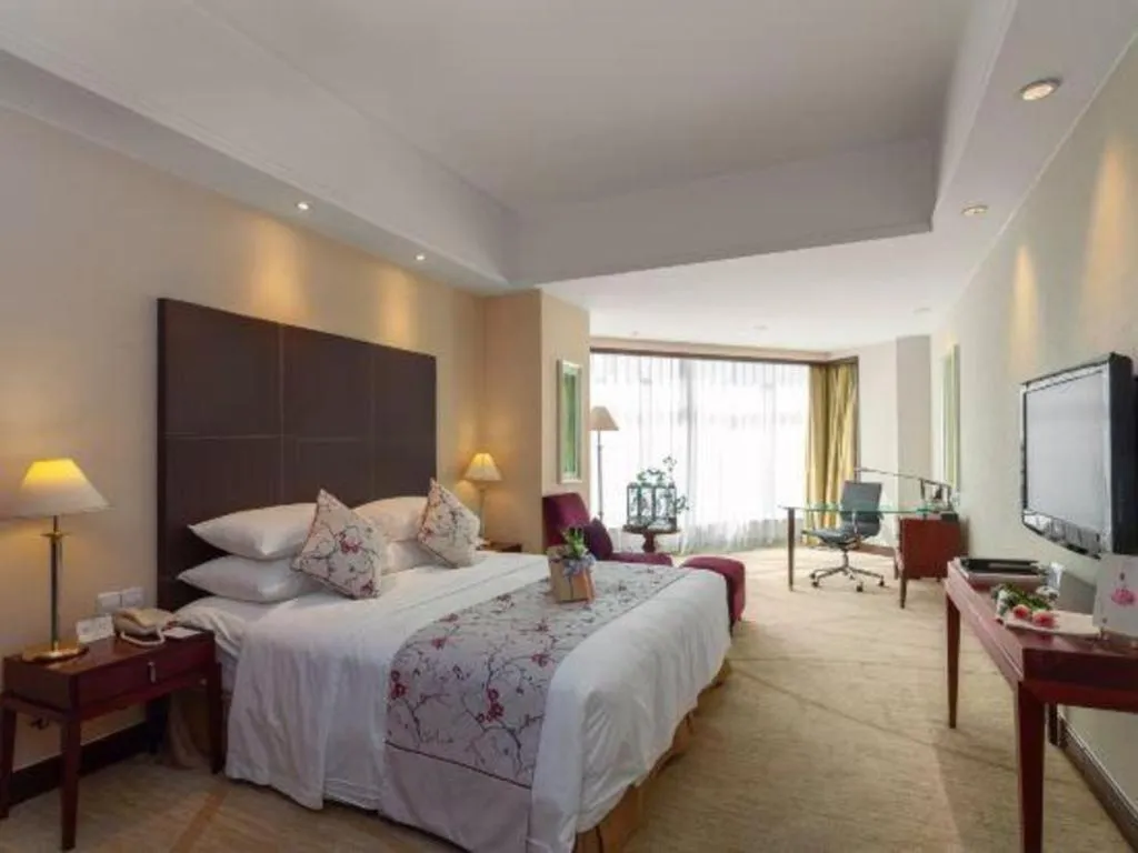 Bed in New Century Grand Hotel Zhuji Yaojiang