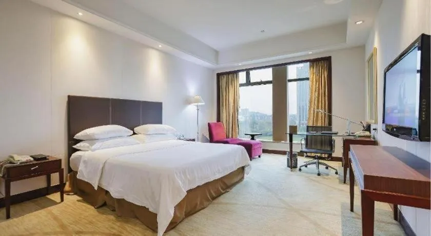 Bed in New Century Grand Hotel Zhuji Yaojiang