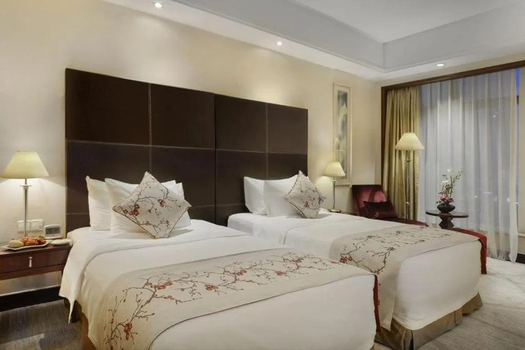 Bed in New Century Grand Hotel Zhuji Yaojiang