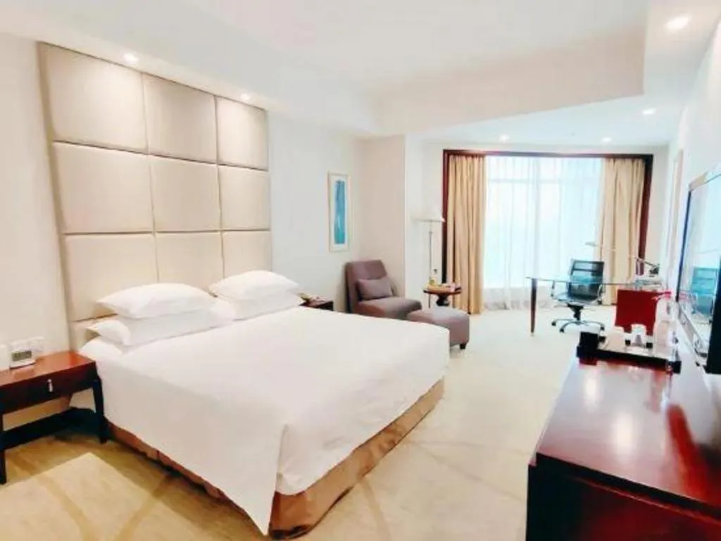 Bed in New Century Grand Hotel Zhuji Yaojiang