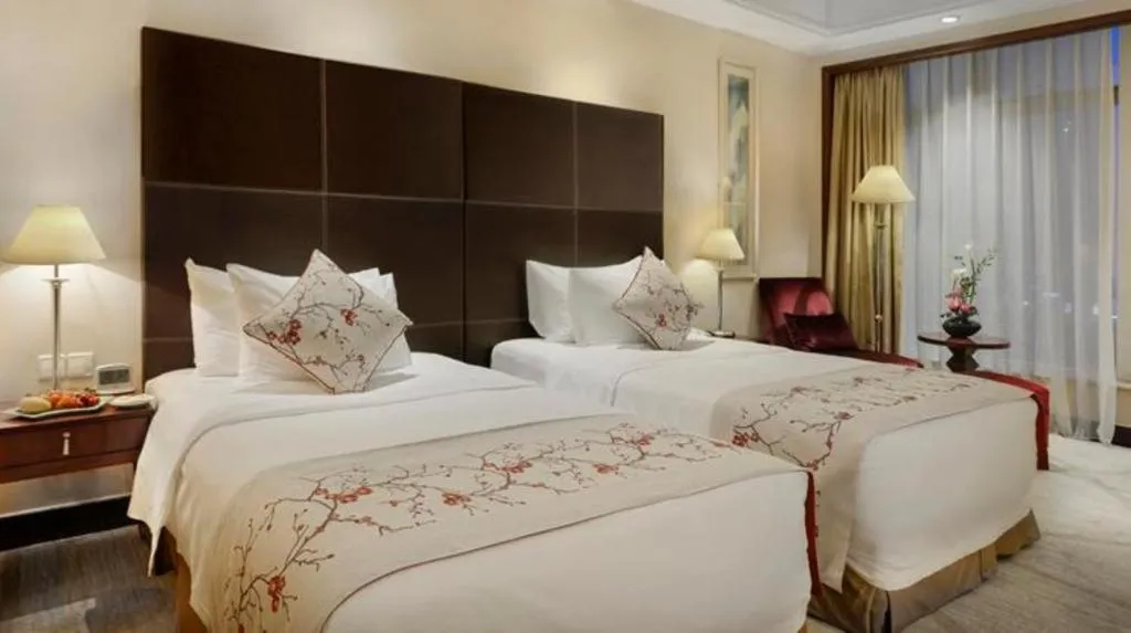 Bed in New Century Grand Hotel Zhuji Yaojiang