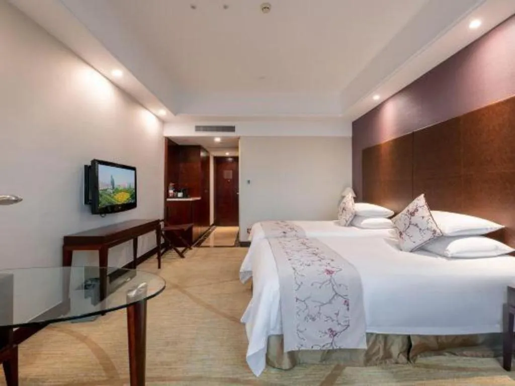 Bed in New Century Grand Hotel Zhuji Yaojiang