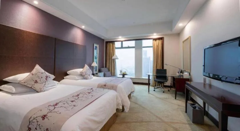 Bed in New Century Grand Hotel Zhuji Yaojiang