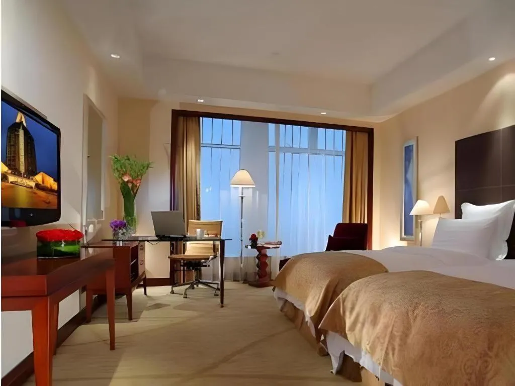 Bed in New Century Grand Hotel Zhuji Yaojiang