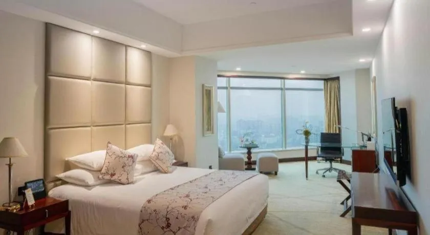 Bed in New Century Grand Hotel Zhuji Yaojiang