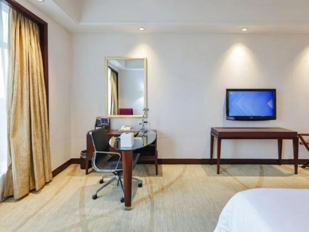 Bed in New Century Grand Hotel Zhuji Yaojiang