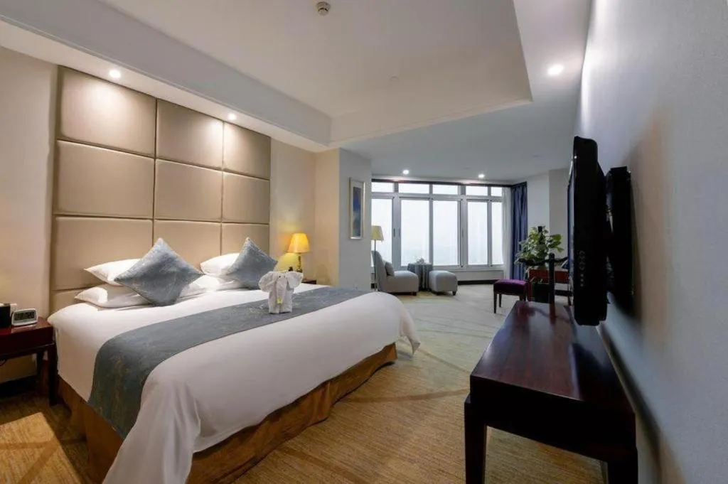 Bed in New Century Grand Hotel Zhuji Yaojiang