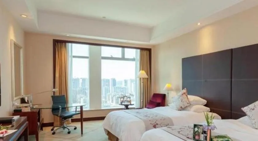 Bed in New Century Grand Hotel Zhuji Yaojiang