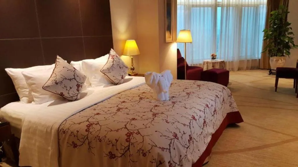 Bed in New Century Grand Hotel Zhuji Yaojiang
