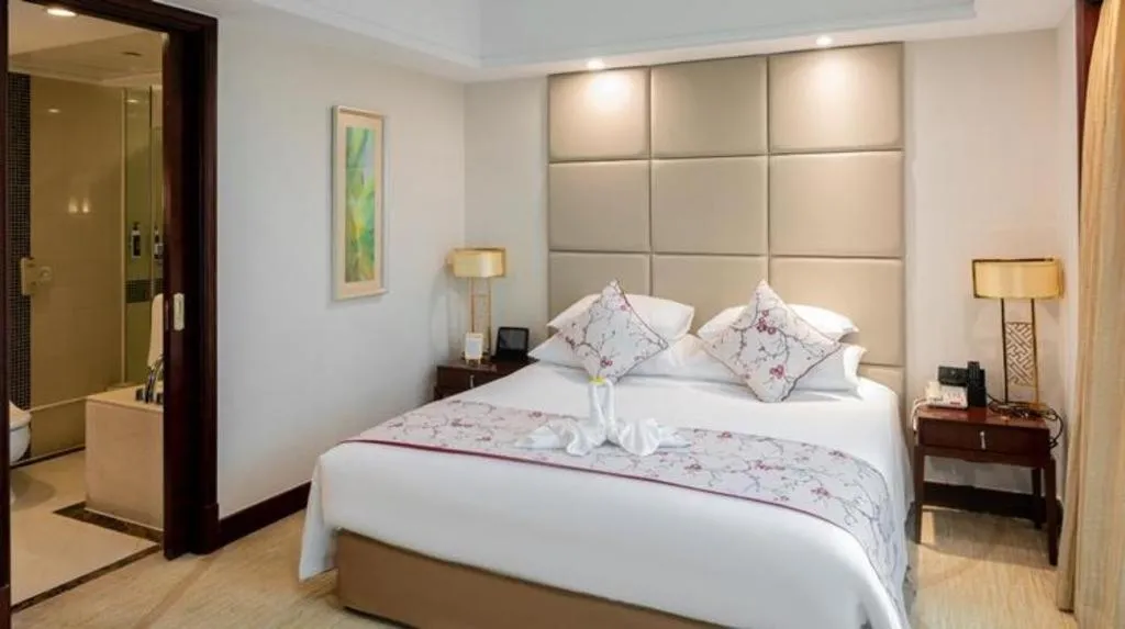 Bed in New Century Grand Hotel Zhuji Yaojiang