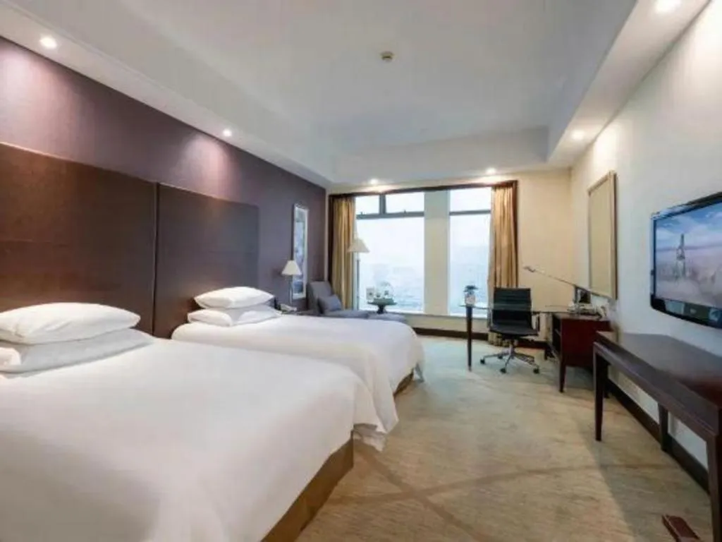 Bed in New Century Grand Hotel Zhuji Yaojiang