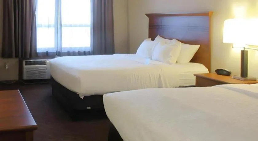 Bed in Quality Inn & Suites Detroit Lakes