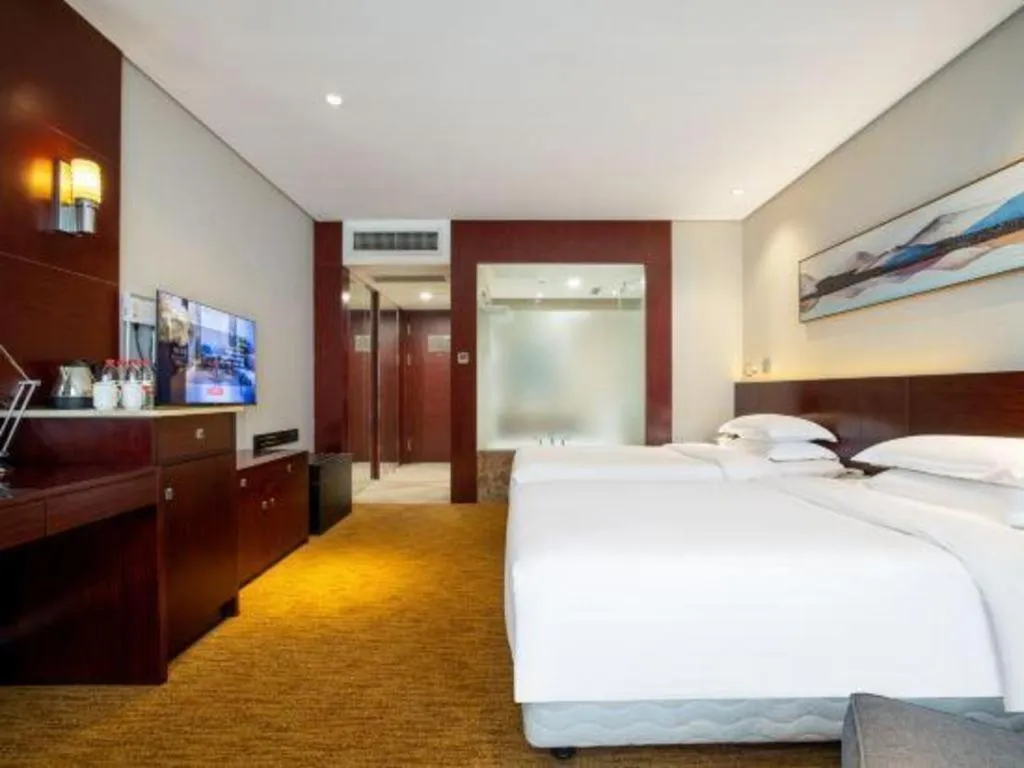 Bed in New Century Hotel Nanjing