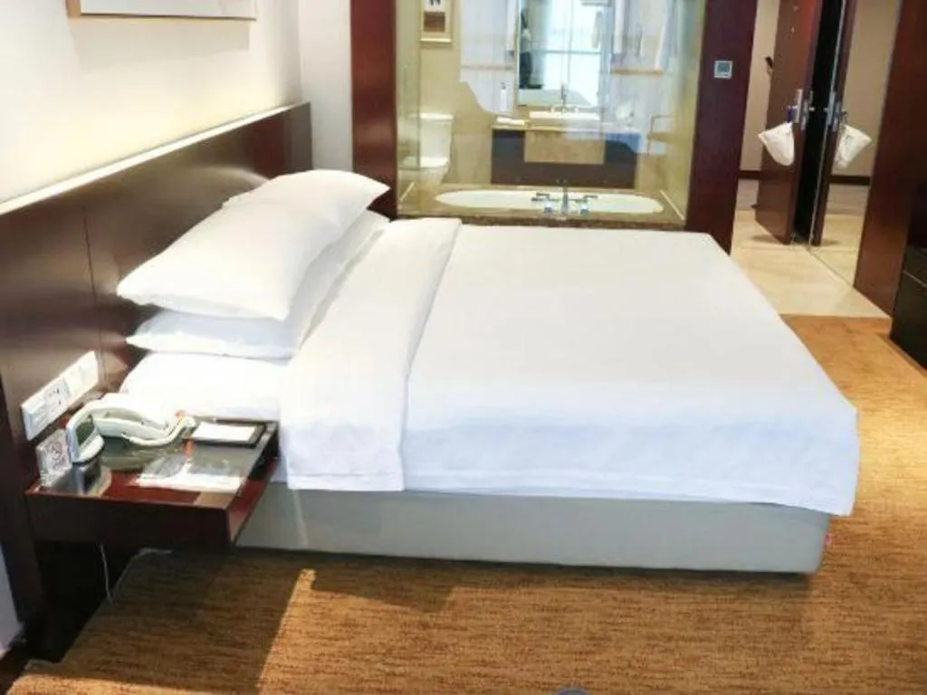 Bed in New Century Hotel Nanjing