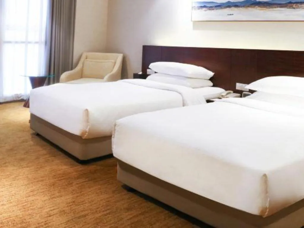 Bed in New Century Hotel Nanjing