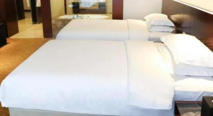 Bed in New Century Hotel Nanjing