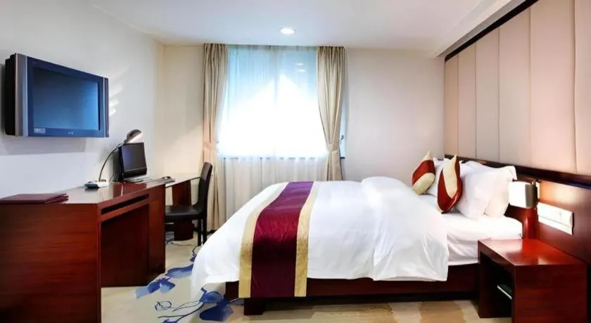 Bed in New World Hotel