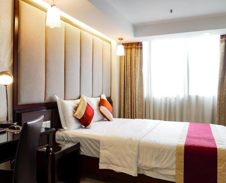 Bed in New World Hotel