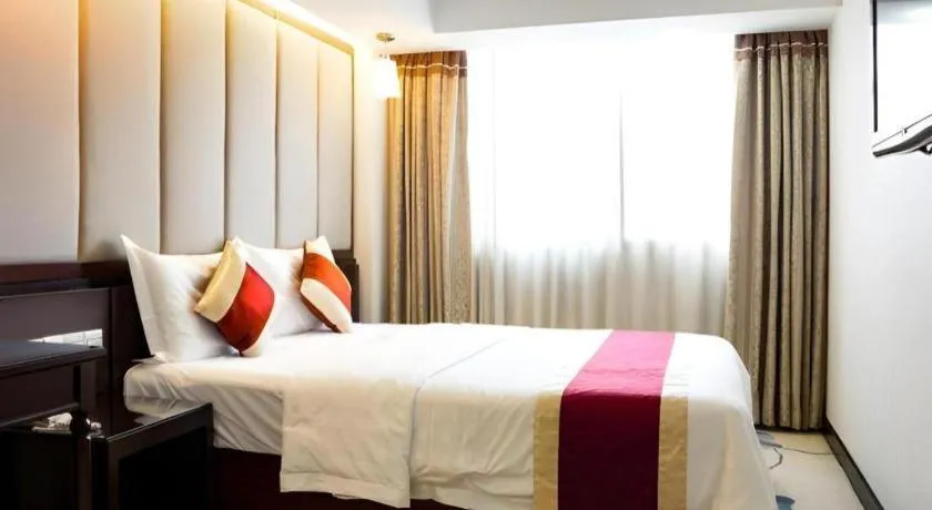 Bed in New World Hotel