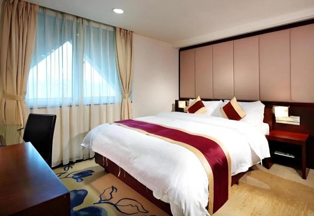 Bed in New World Hotel