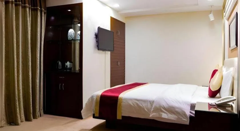 Bed in New World Hotel