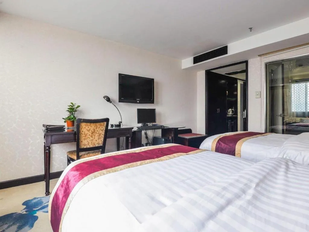 Bed in New World Hotel