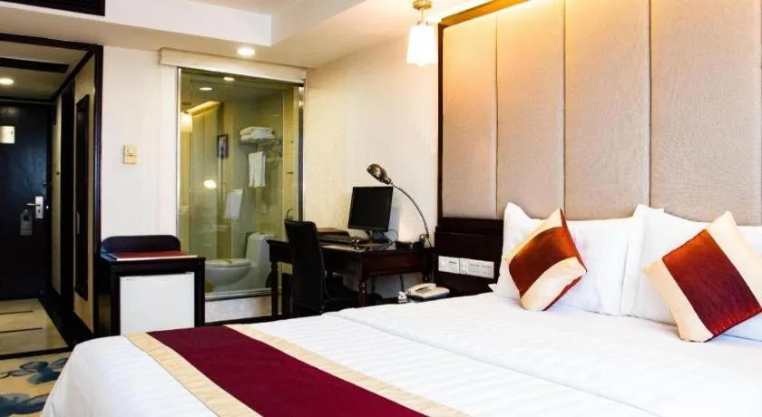 Bed in New World Hotel