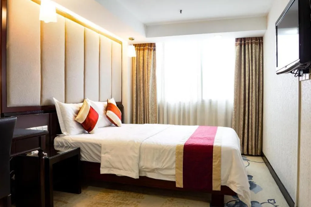 Bed in New World Hotel