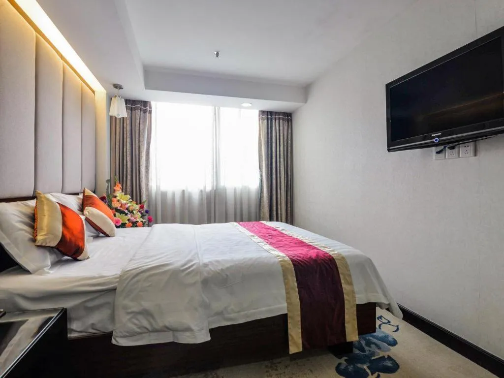 Bed in New World Hotel