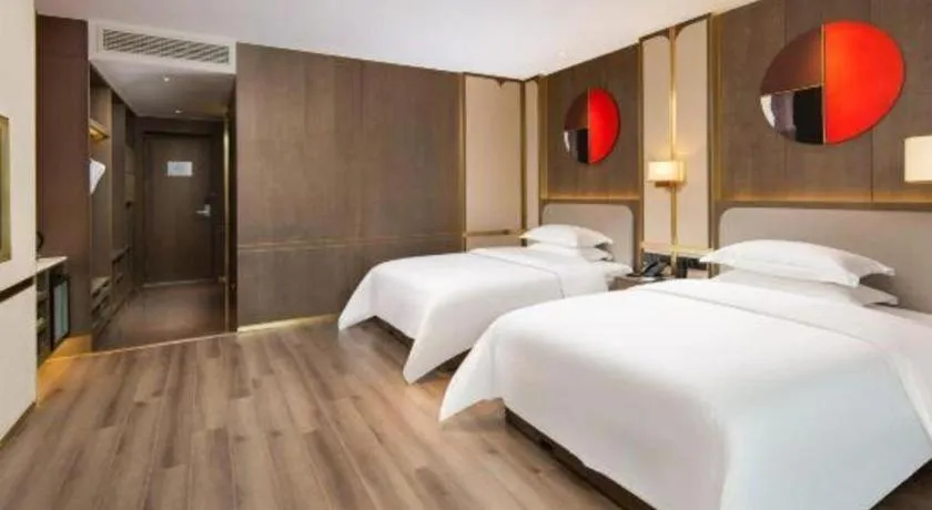 Bed in Zhong Yi Peng Ao Hotel