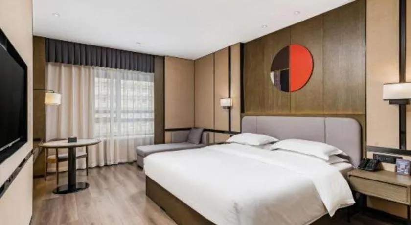 Bed in Zhong Yi Peng Ao Hotel