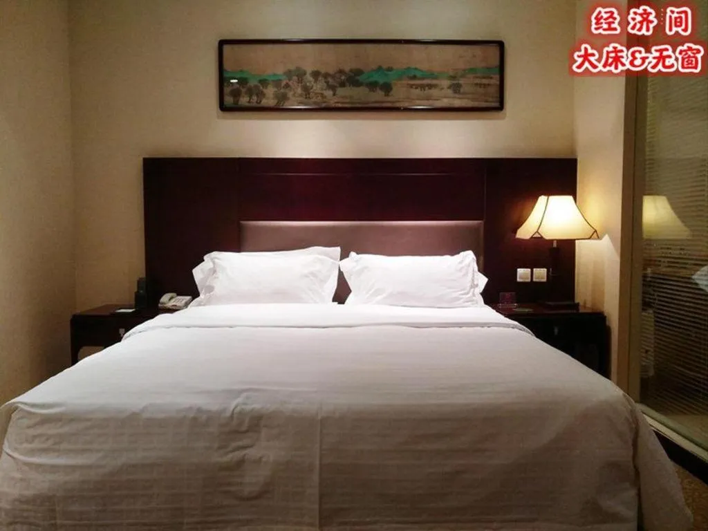 Bed in Zhong Yi Peng Ao Hotel