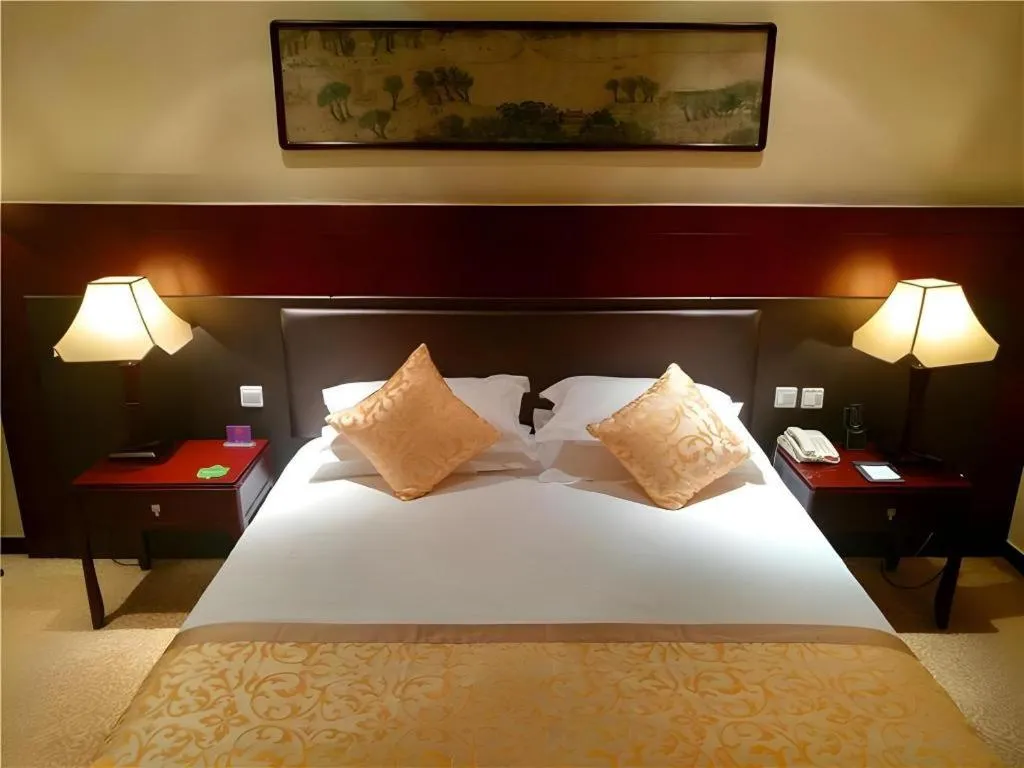 Bed in Zhong Yi Peng Ao Hotel