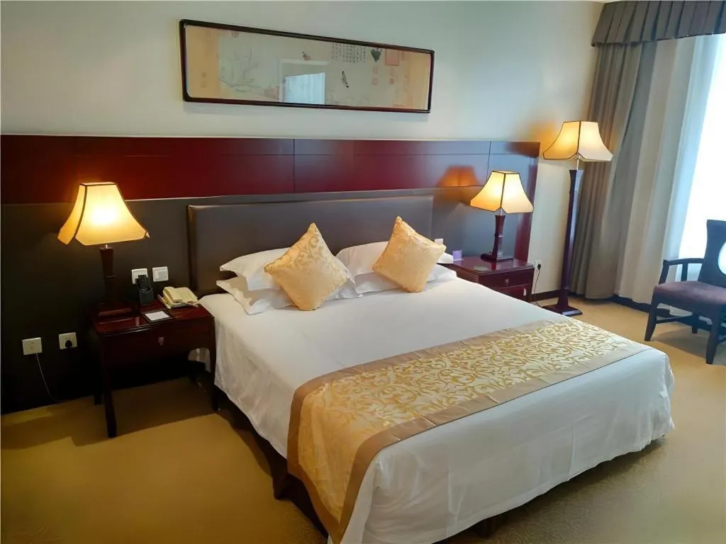 Bed in Zhong Yi Peng Ao Hotel