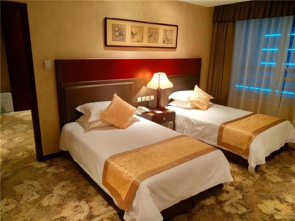 Bed in Zhong Yi Peng Ao Hotel