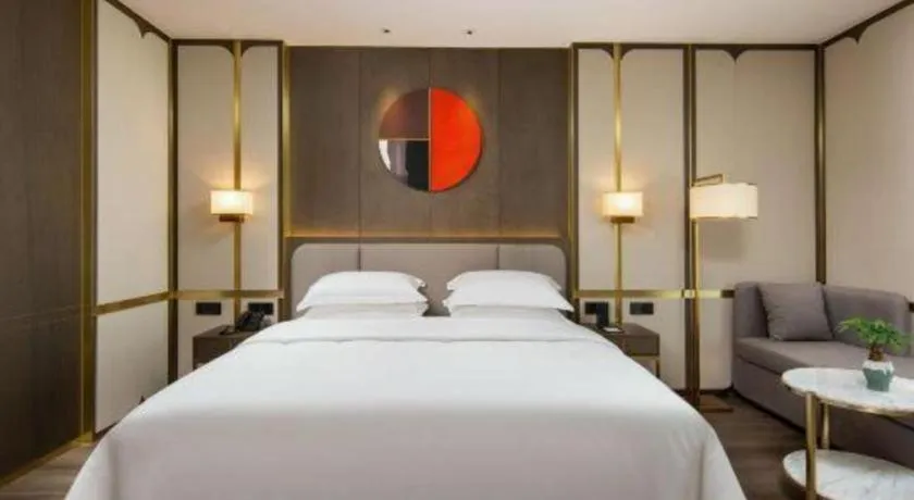 Bed in Zhong Yi Peng Ao Hotel