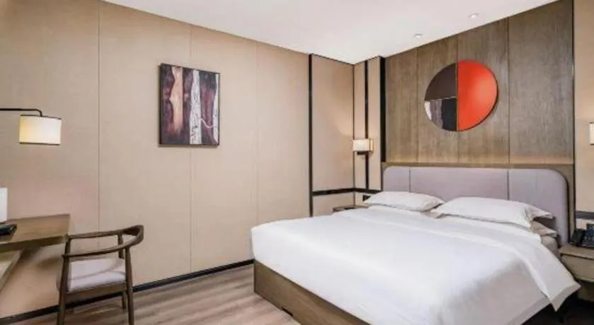 Bed in Zhong Yi Peng Ao Hotel