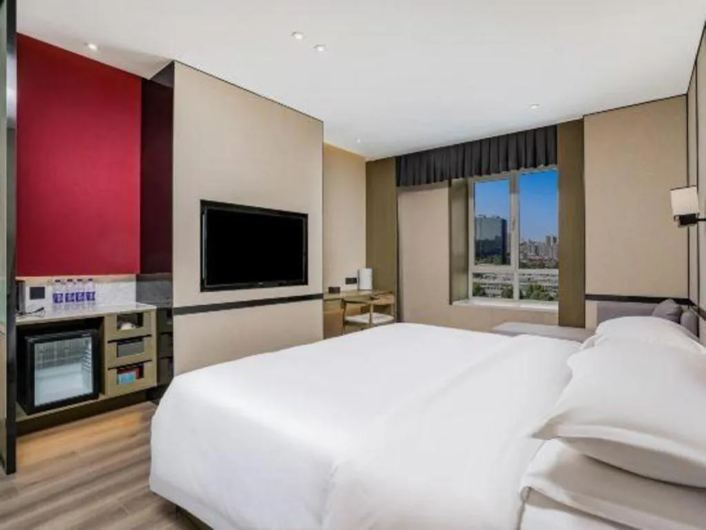 Bed in Zhong Yi Peng Ao Hotel