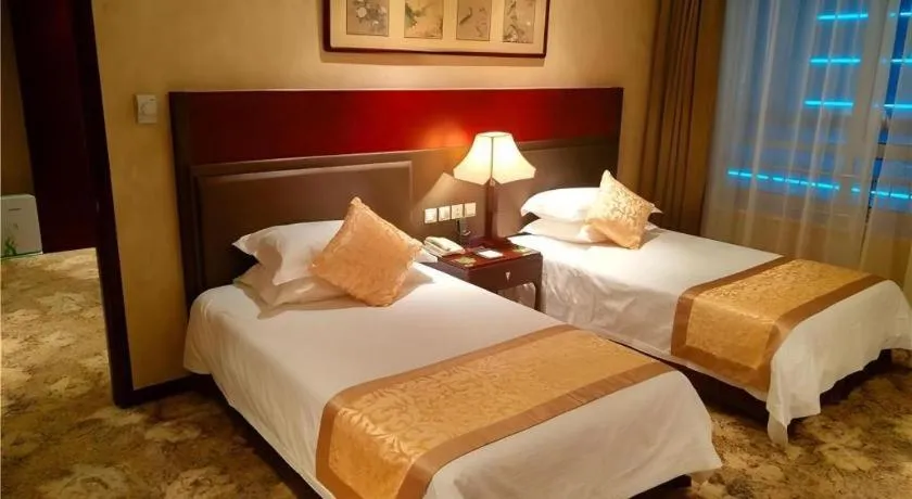 Bed in Zhong Yi Peng Ao Hotel