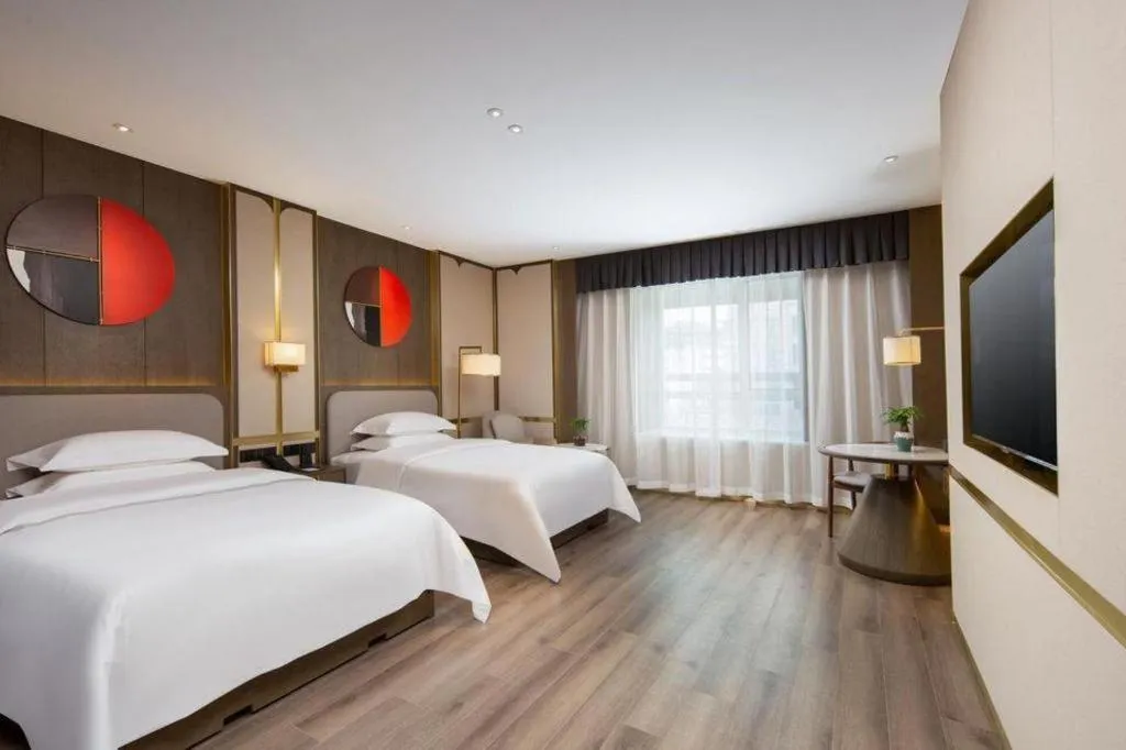 Bed in Zhong Yi Peng Ao Hotel