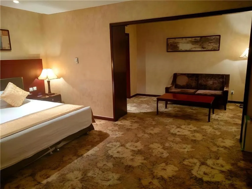 Bed in Zhong Yi Peng Ao Hotel