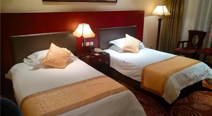 Bed in Zhong Yi Peng Ao Hotel